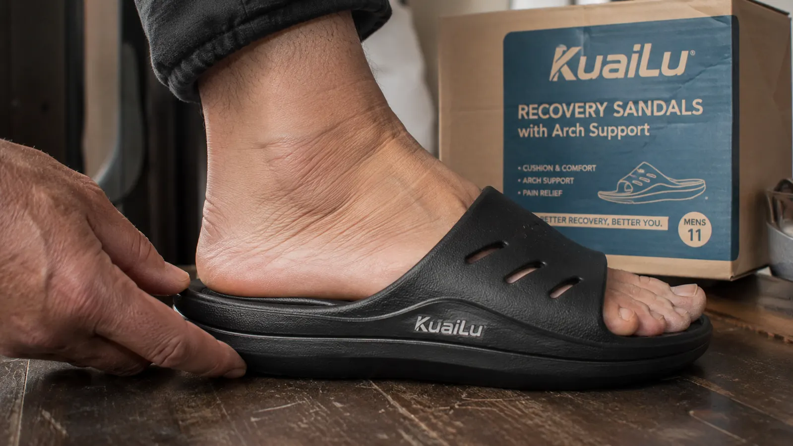 Close-up of a foot in an arch support sandal showing the contoured footbed and cushion layer